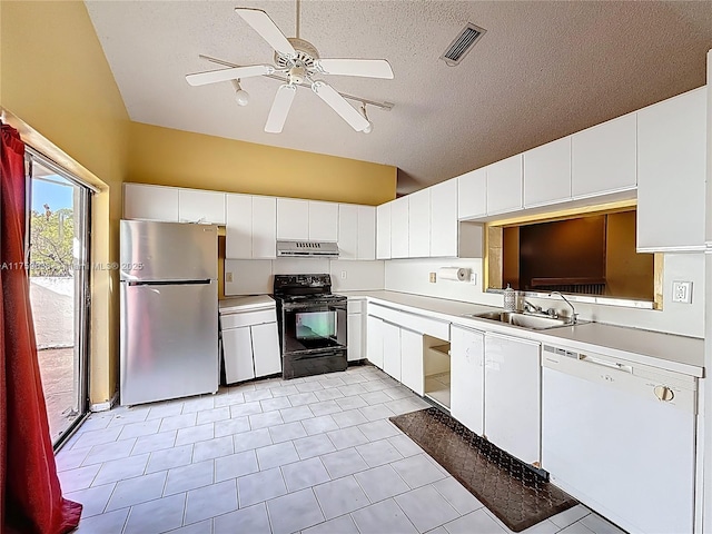 kitchen featuring visible vents, under cabinet range hood, black electric range, freestanding refrigerator, and white dishwasher