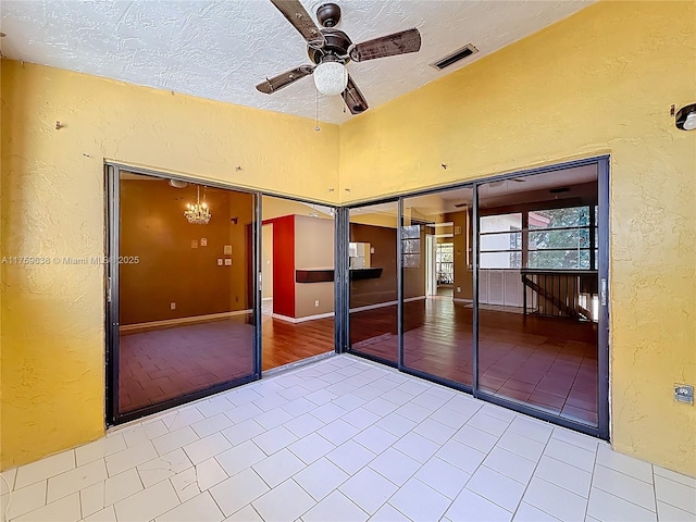 view of patio featuring visible vents and ceiling fan