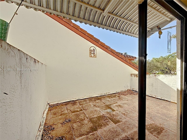 view of patio / terrace featuring fence