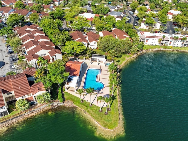 drone / aerial view with a residential view and a water view