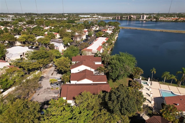 birds eye view of property with a water view and a residential view