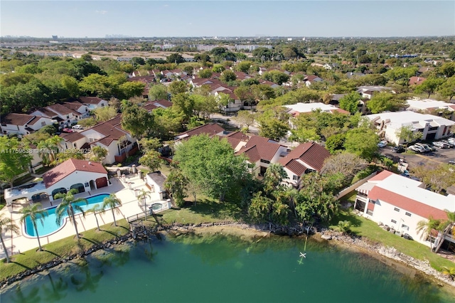 birds eye view of property with a residential view and a water view