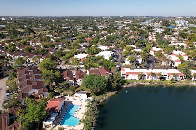 birds eye view of property with a water view and a residential view