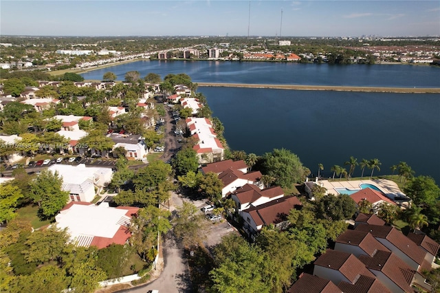 bird's eye view featuring a water view and a residential view