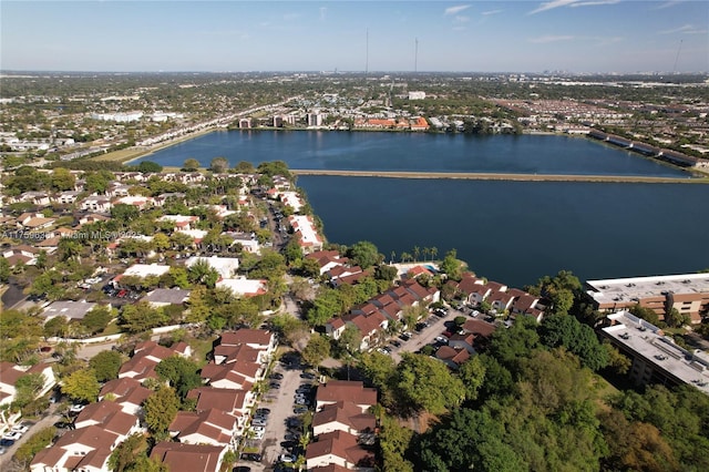 drone / aerial view featuring a residential view and a water view