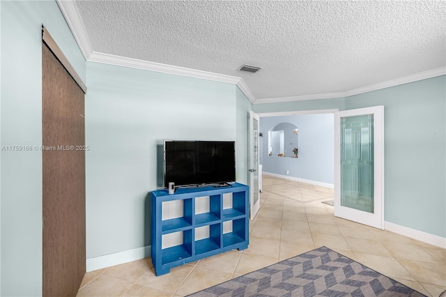 tiled living room with arched walkways, french doors, crown molding, visible vents, and a textured ceiling