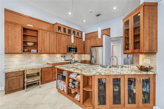 kitchen with open shelves, appliances with stainless steel finishes, brown cabinetry, and a sink