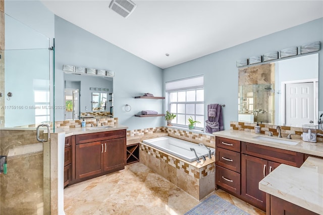 full bath featuring a stall shower, visible vents, a sink, and a bath