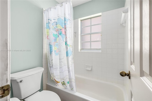 full bathroom with shower / tub combo and toilet