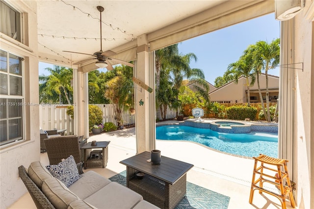 view of swimming pool featuring a pool with connected hot tub, a ceiling fan, a patio area, a fenced backyard, and an outdoor living space