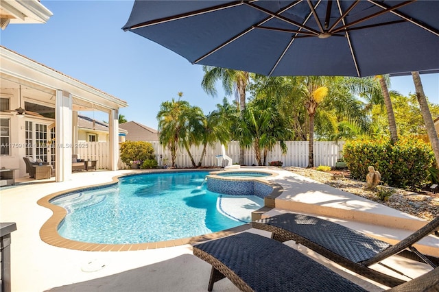 view of pool featuring a patio, a fenced backyard, a pool with connected hot tub, a ceiling fan, and french doors