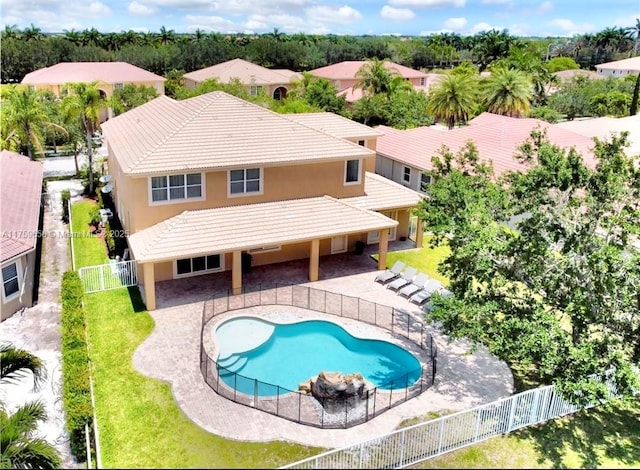 view of pool with a fenced in pool, a patio area, a fenced backyard, and a yard