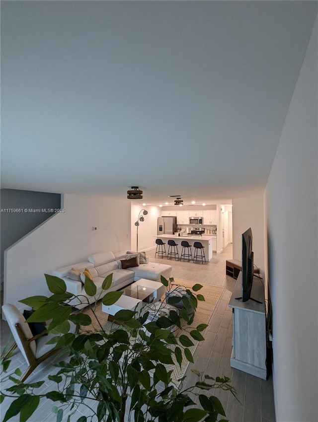 living area with wood finish floors