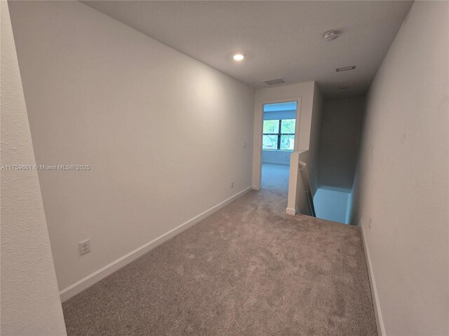 6001 Woods Edge Cir, Riviera Beach, FL 33410 - hallway featuring an upstairs landing, carpet, and recessed lighting