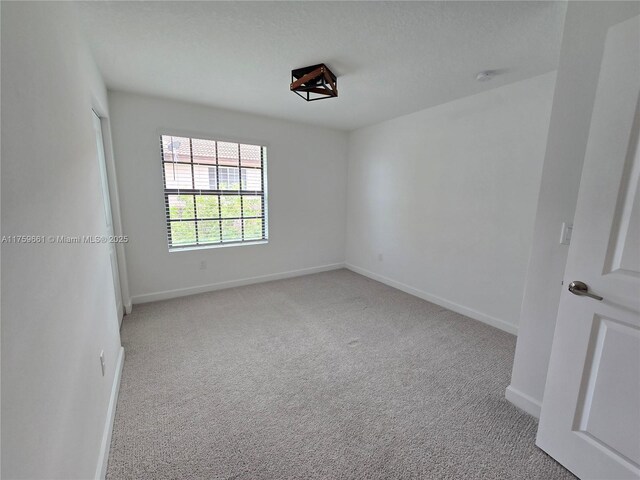 6001 Woods Edge Cir, Riviera Beach, FL 33410 - spare room with carpet flooring