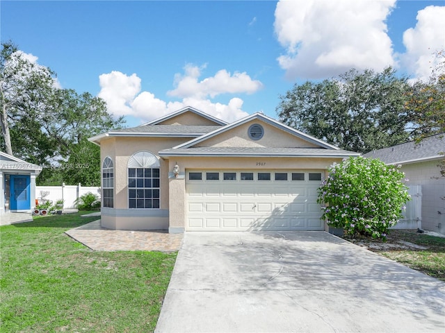 single story home with driveway, a garage, fence, a front lawn, and stucco siding