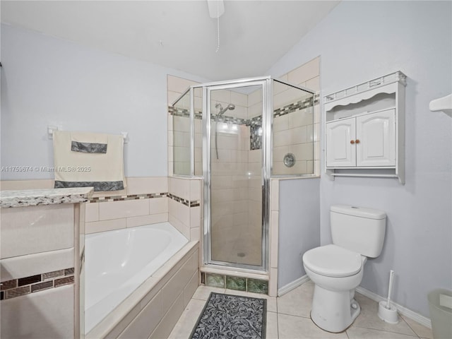 bathroom featuring tile patterned flooring, a garden tub, a shower stall, and toilet