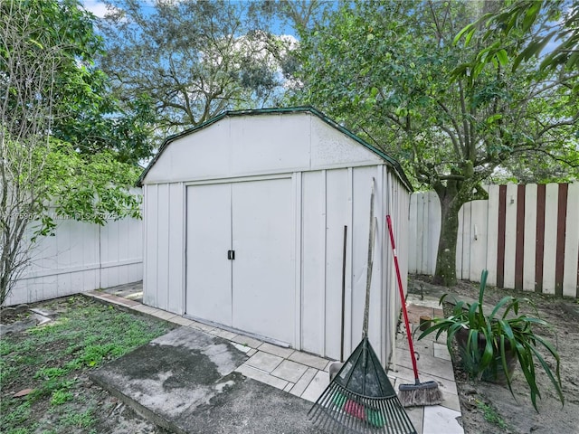 view of shed with a fenced backyard