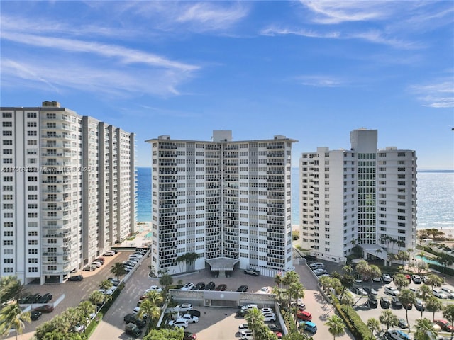 view of property with a view of city and a water view