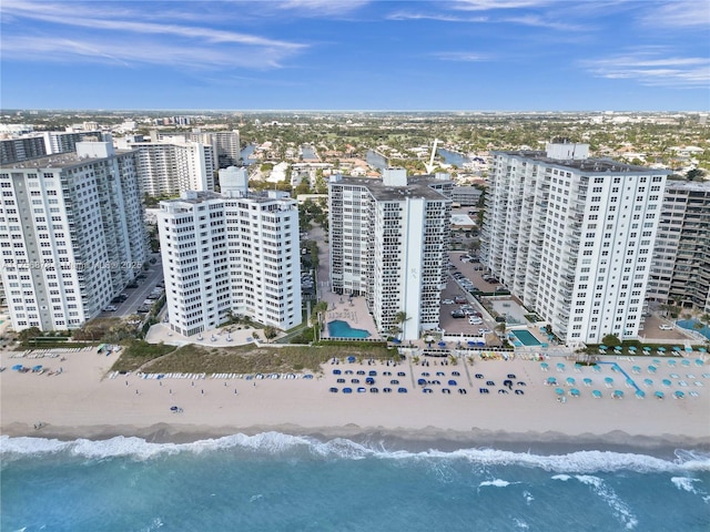 aerial view with a water view, a city view, and a view of the beach