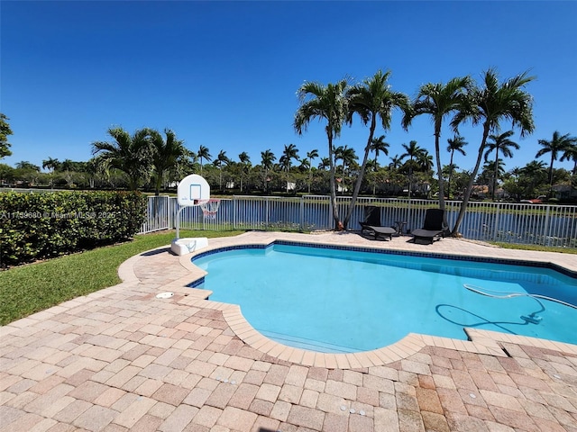 view of swimming pool featuring a fenced in pool, a patio, and fence