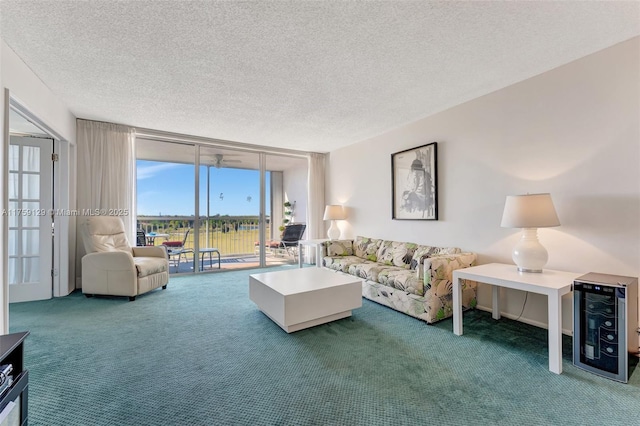 carpeted living area with beverage cooler, expansive windows, and a textured ceiling