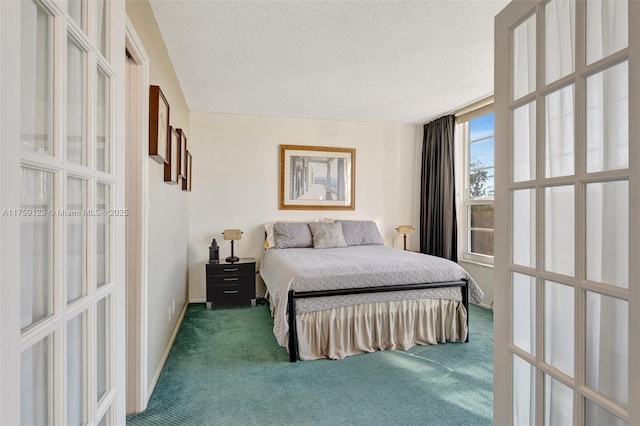 carpeted bedroom featuring baseboards, a textured ceiling, and french doors