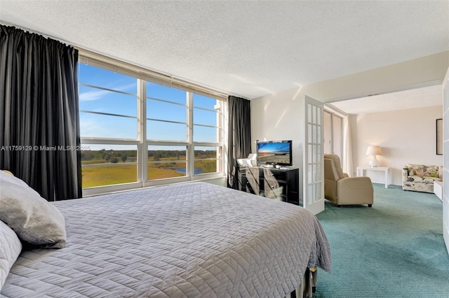 carpeted bedroom featuring a textured ceiling