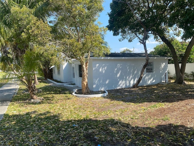 view of side of property with fence