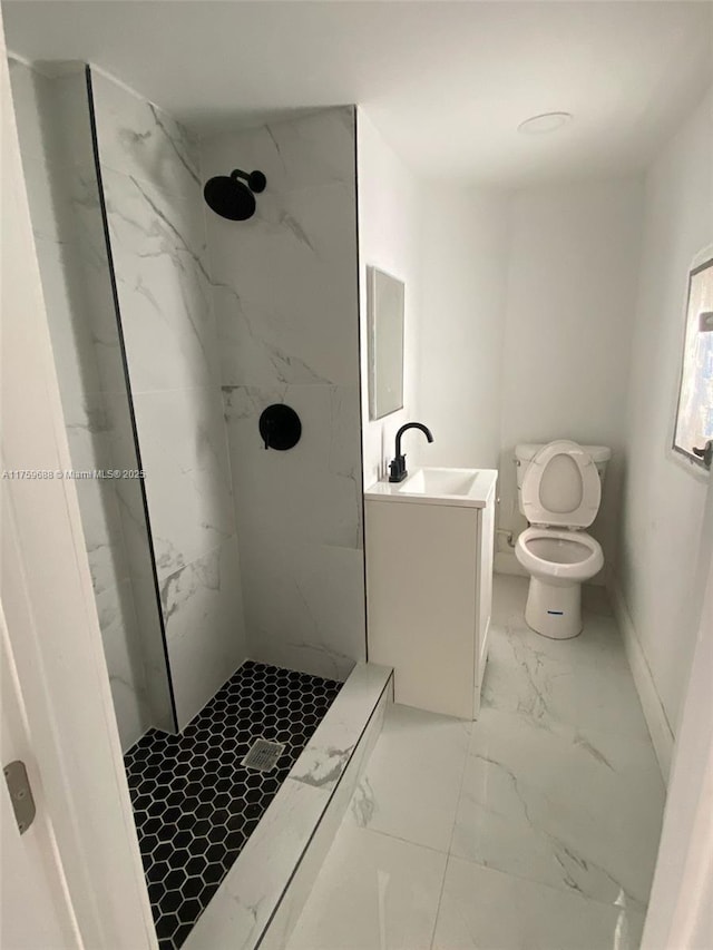 full bathroom featuring vanity, toilet, marble finish floor, and a marble finish shower