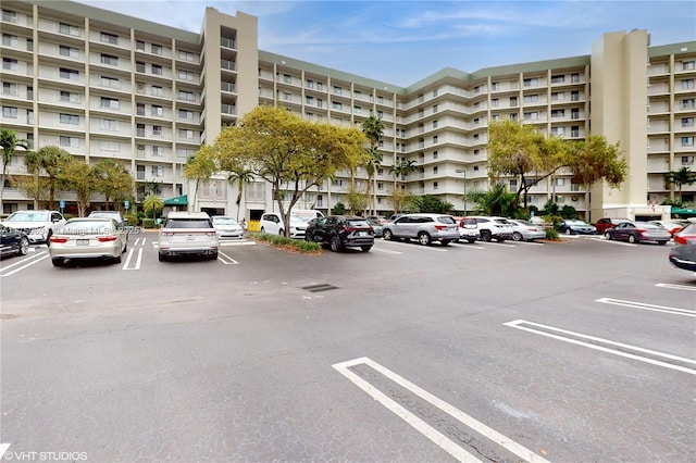 view of building exterior featuring uncovered parking