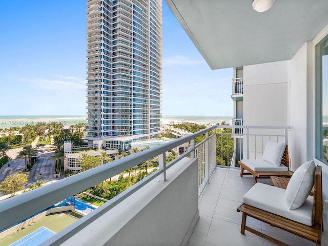 balcony featuring a water view