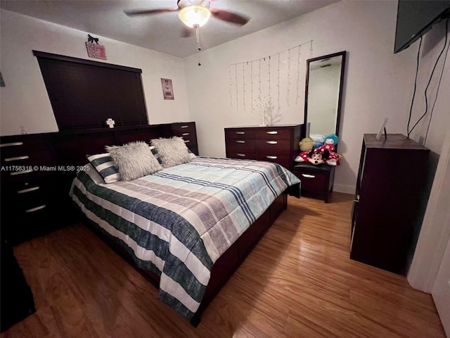 bedroom featuring ceiling fan and wood finished floors