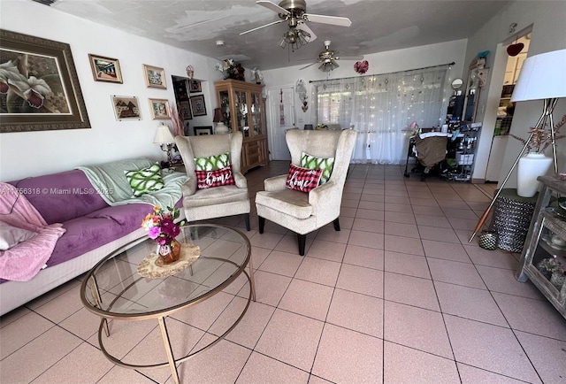 living area featuring a ceiling fan and tile patterned floors