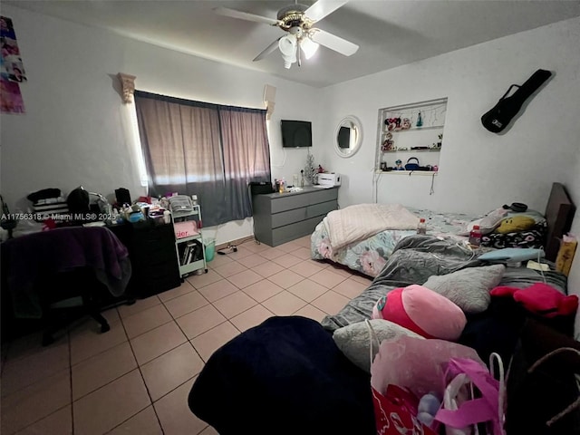 tiled bedroom with ceiling fan