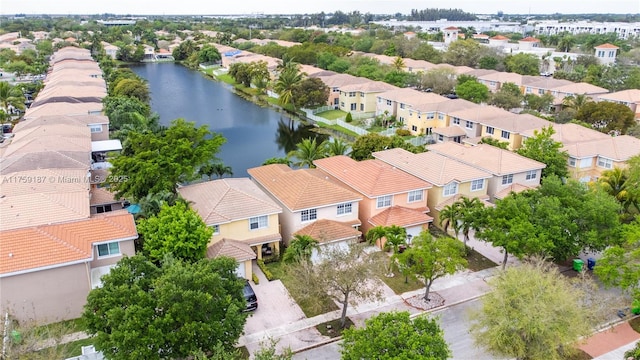 drone / aerial view with a water view and a residential view