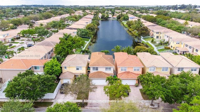 bird's eye view with a residential view and a water view