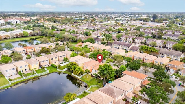 bird's eye view with a water view and a residential view