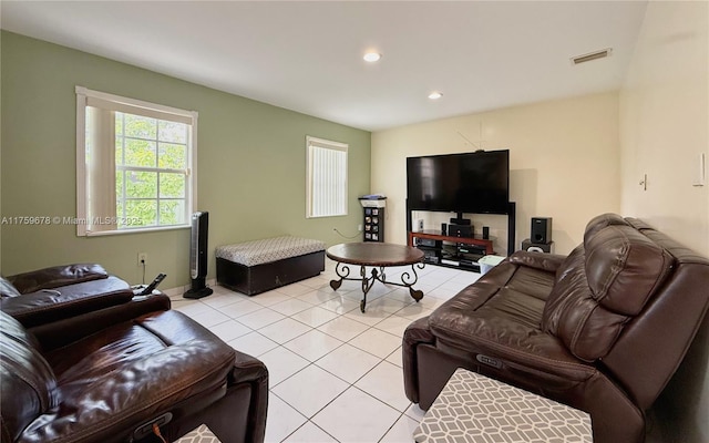 living room with light tile patterned floors, visible vents, and recessed lighting