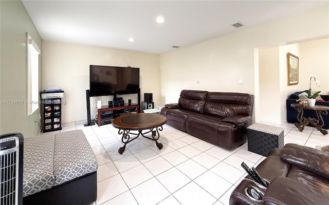 living room featuring recessed lighting, visible vents, heating unit, and light tile patterned flooring