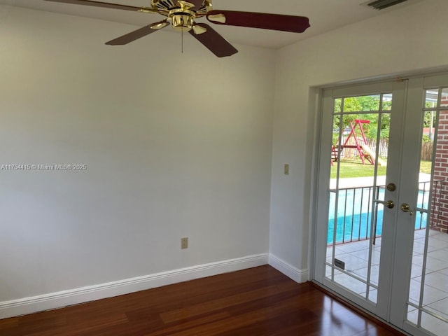 15030 SW 89th Ave, Palmetto Bay, FL 33176 - spare room featuring french doors, a ceiling fan, baseboards, and wood finished floors
