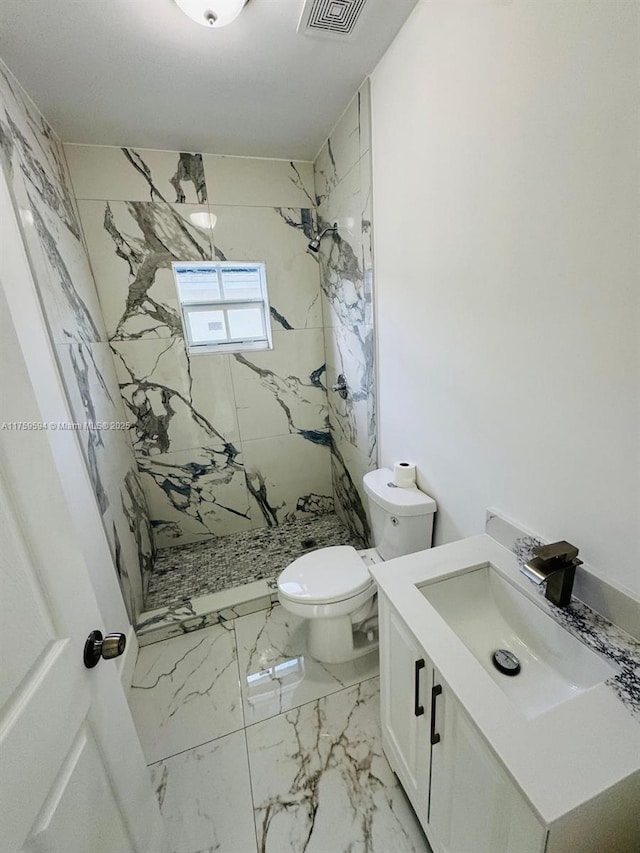 bathroom with vanity, visible vents, a marble finish shower, toilet, and marble finish floor