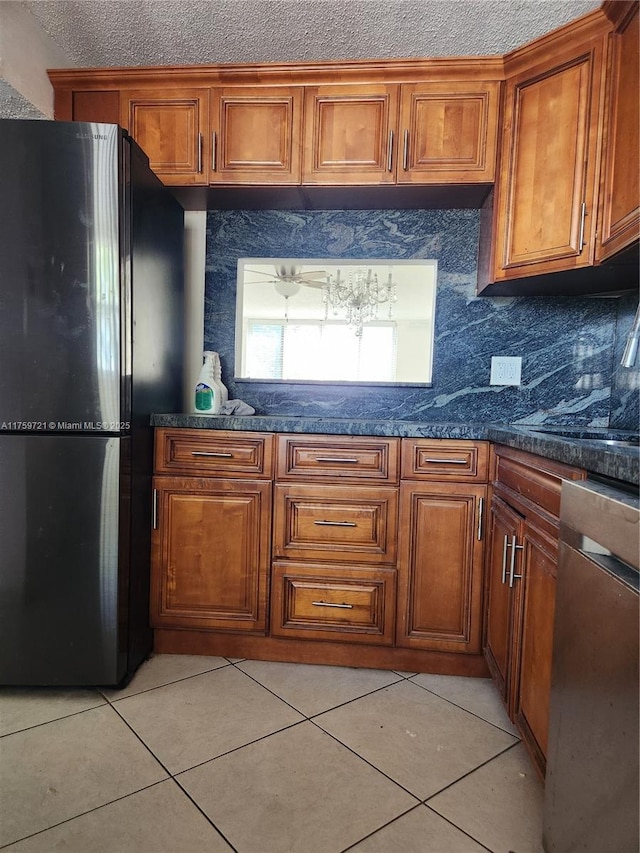 6670 Royal Palm Unit K 202, Pompano Beach, FL 33063 - kitchen featuring freestanding refrigerator, dishwasher, brown cabinetry, and light tile patterned flooring