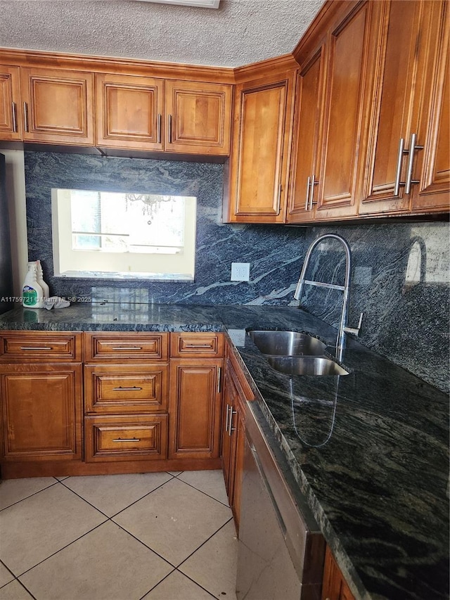 6670 Royal Palm Unit K 202, Pompano Beach, FL 33063 - kitchen with dishwasher, brown cabinets, a sink, and light tile patterned flooring