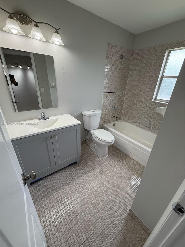 full bathroom with  shower combination, vanity, toilet, and tile patterned floors