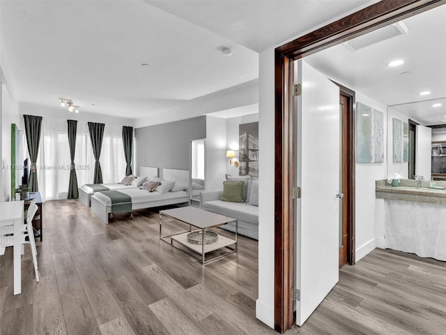 living room featuring wood finished floors and recessed lighting