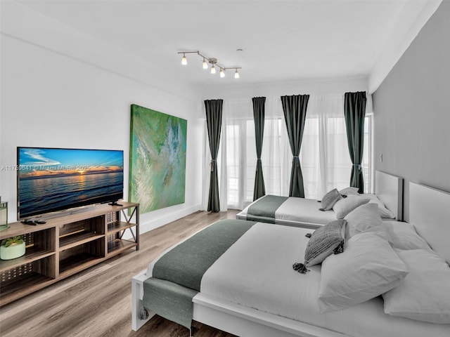 bedroom with wood finished floors