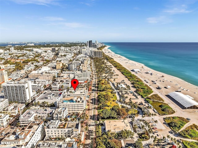 aerial view featuring a view of city, a water view, and a view of the beach