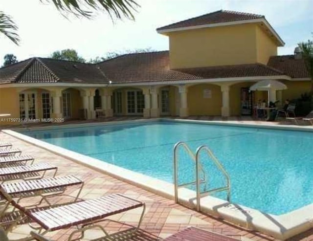 community pool featuring a patio