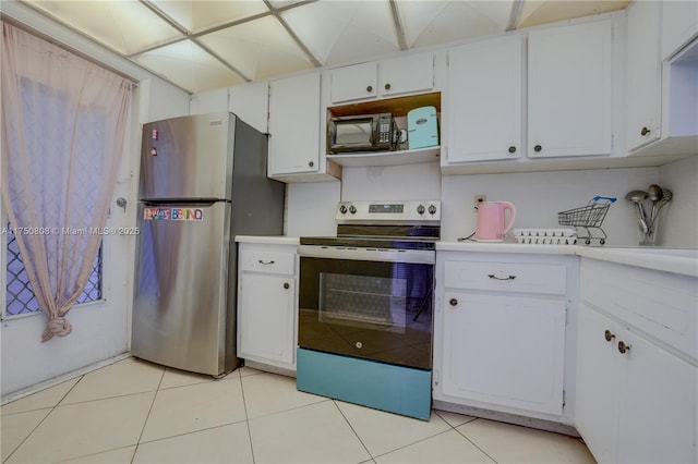 kitchen featuring stainless steel appliances, light countertops, and white cabinetry